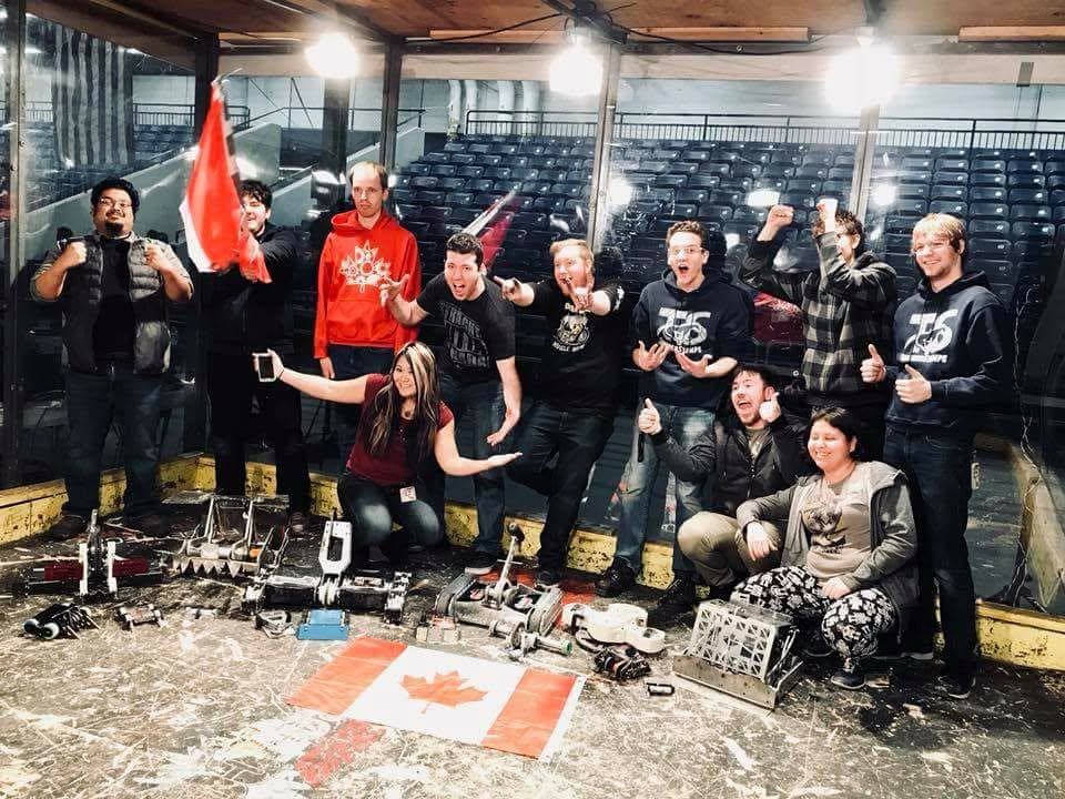 Canadian combat robotics team celebration with Canadian flags and multiple robots